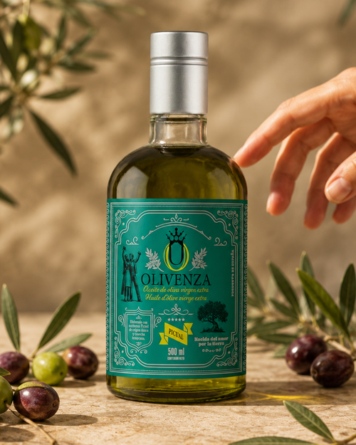 Bottle of Olivenza olive oil with a hand reaching out, surrounded by olives and olive branches.
